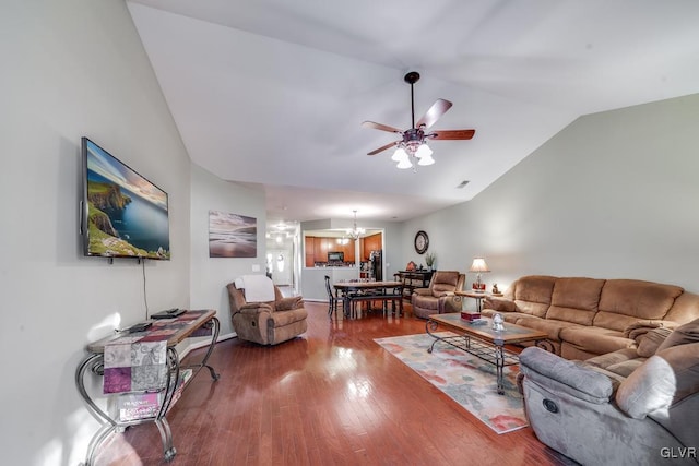 living room featuring ceiling fan with notable chandelier, wood-type flooring, and lofted ceiling