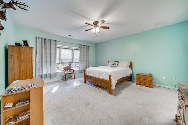 bedroom with ceiling fan and light colored carpet