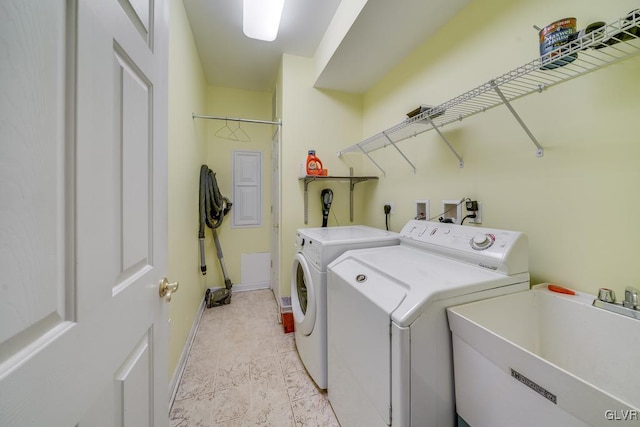 laundry room with sink and washing machine and dryer