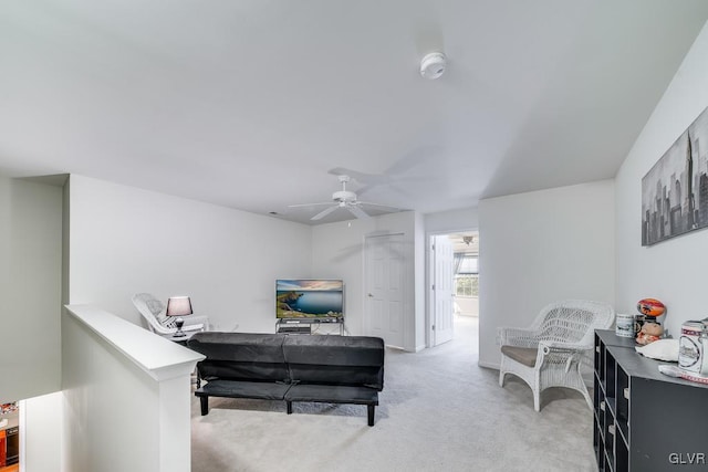 living room featuring ceiling fan and carpet flooring