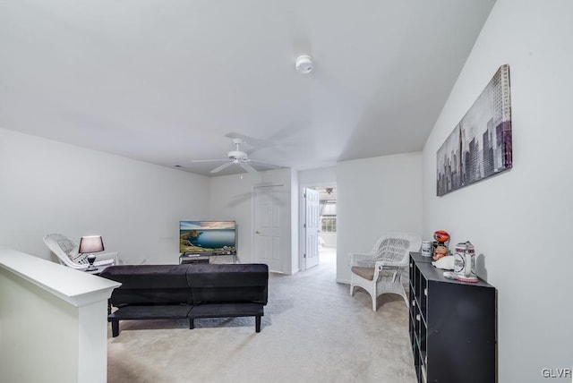 interior space with ceiling fan