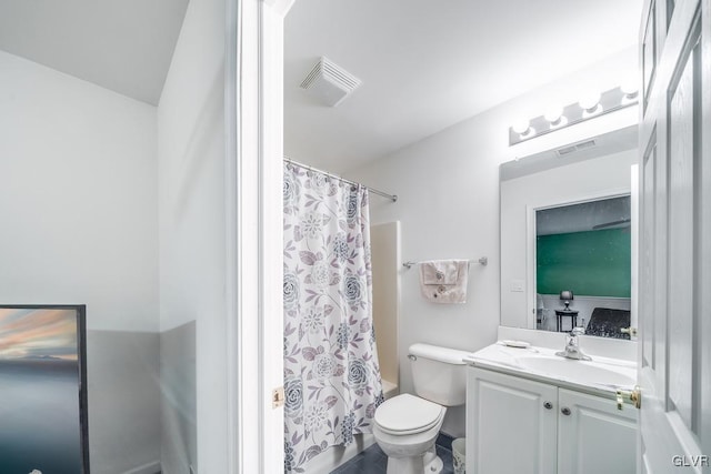 full bathroom with toilet, shower / bath combination with curtain, and vanity