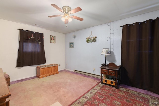 interior space featuring a baseboard heating unit, ceiling fan, light carpet, and baseboards