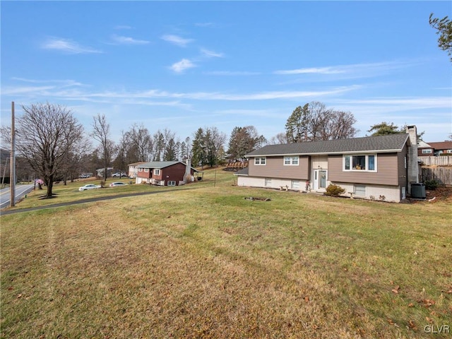 view of yard featuring entry steps and central AC