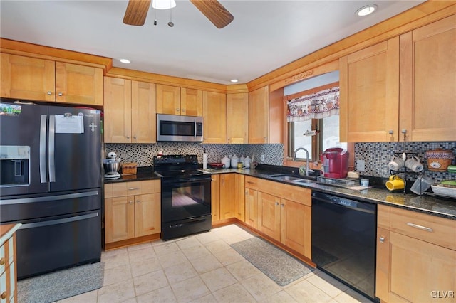 kitchen with decorative backsplash, a ceiling fan, a sink, dark stone counters, and black appliances