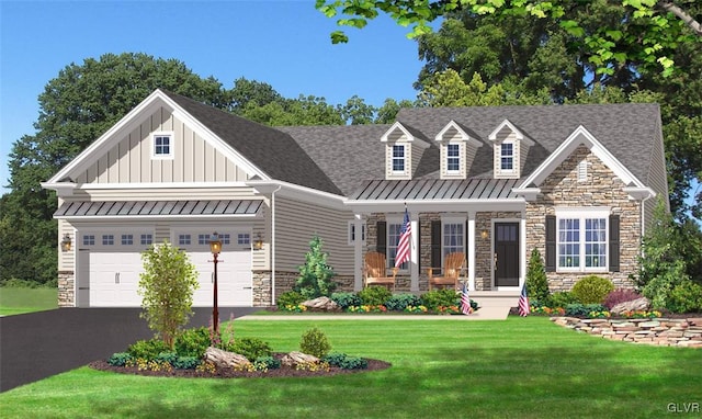 view of front of property with a front yard and a garage