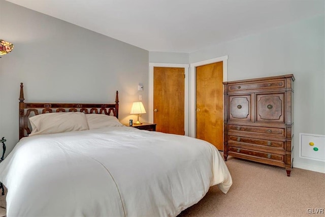 bedroom with light colored carpet