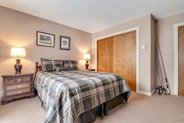 carpeted bedroom with a closet