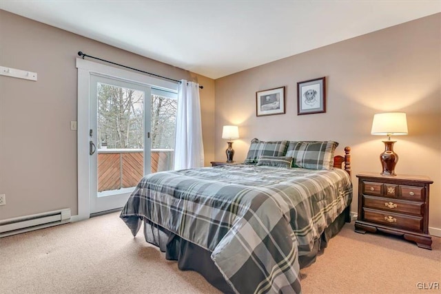 carpeted bedroom featuring a baseboard heating unit