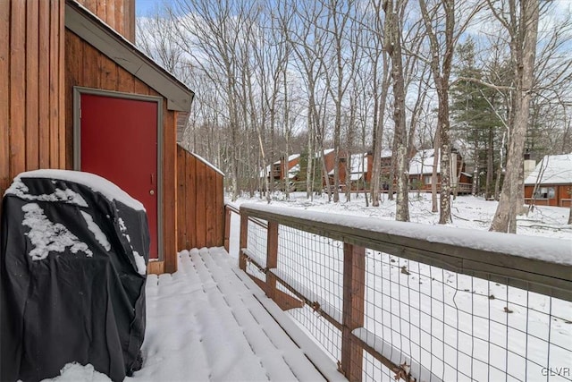 view of snow covered deck