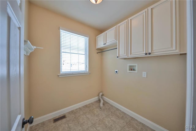 laundry area with hookup for a washing machine, electric dryer hookup, and cabinets