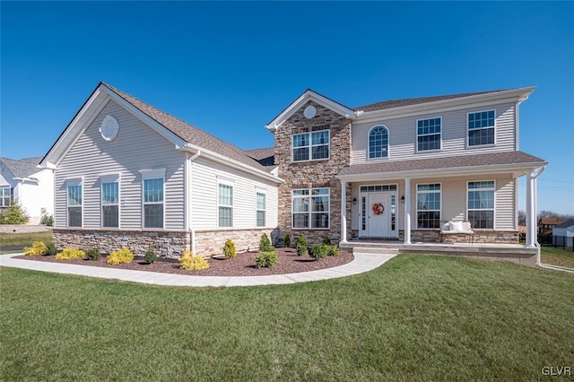 view of front facade featuring a front lawn and a porch