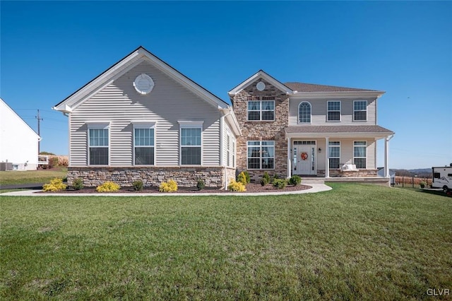 view of front of home with a porch and a front lawn