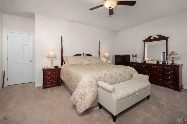 bedroom with ceiling fan and light colored carpet