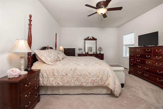 bedroom featuring ceiling fan and light carpet