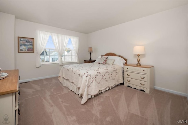 bedroom featuring light carpet