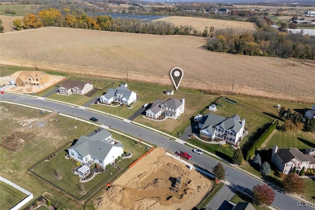 birds eye view of property with a rural view