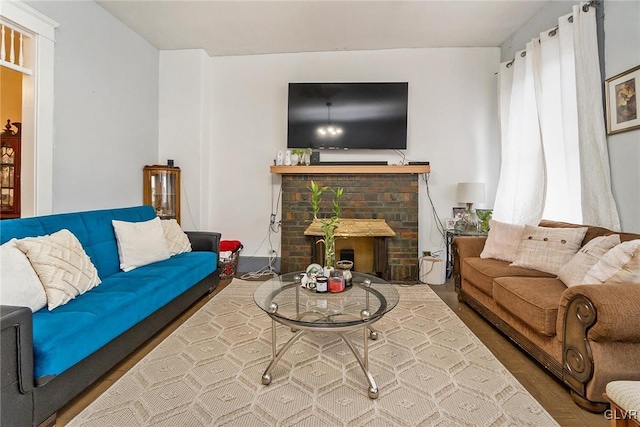 living room with a brick fireplace