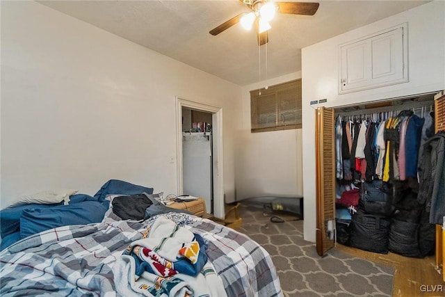 bedroom featuring ceiling fan and a closet