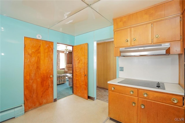 kitchen featuring black electric cooktop and baseboard heating