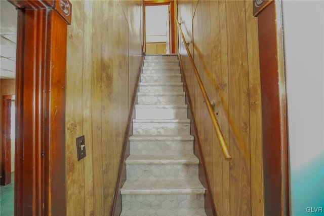 staircase with wooden walls