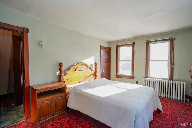 bedroom featuring radiator