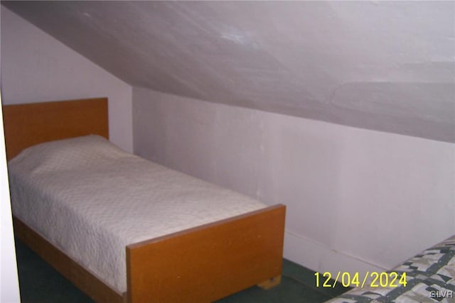 bedroom featuring lofted ceiling