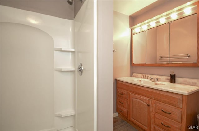 bathroom featuring vanity and walk in shower