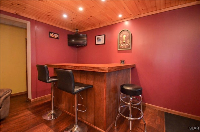 bar with wood ceiling and dark hardwood / wood-style flooring