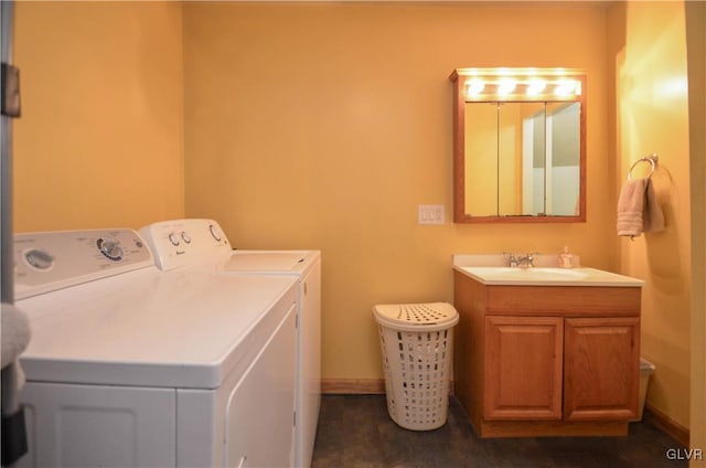 clothes washing area with sink and independent washer and dryer