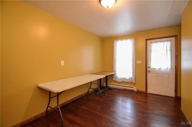 office area with a baseboard radiator and dark hardwood / wood-style floors