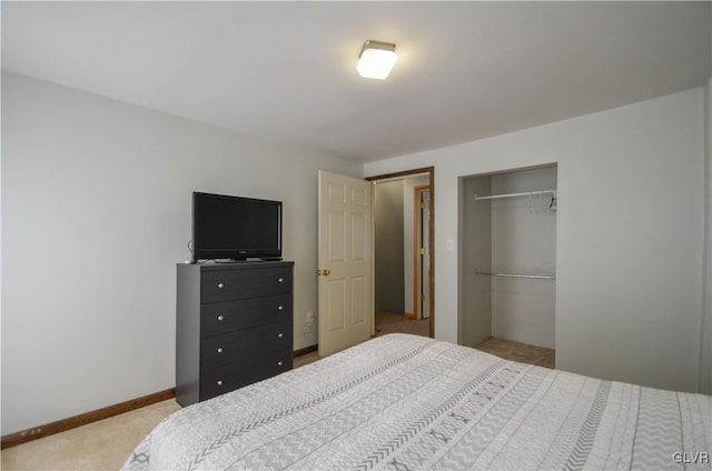 carpeted bedroom with a closet