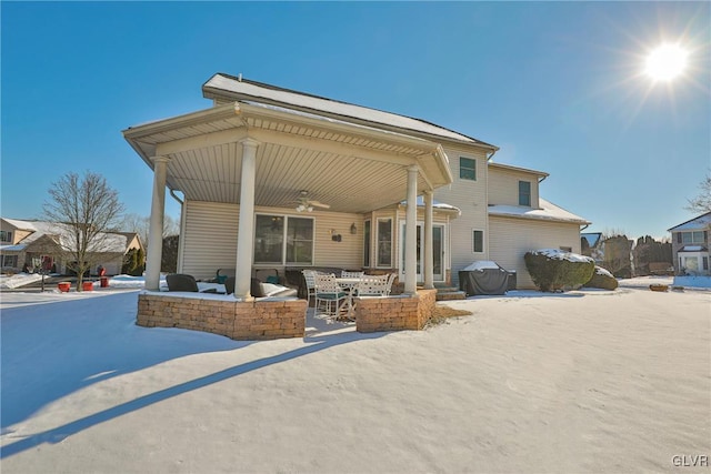 rear view of house with ceiling fan