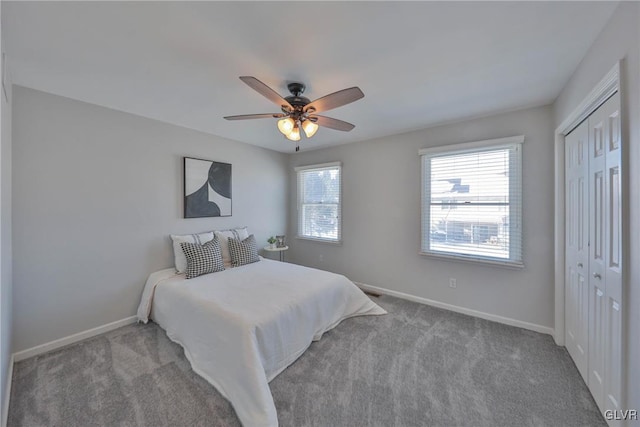 bedroom with light carpet, a closet, and ceiling fan