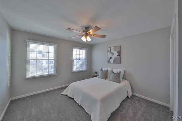 bedroom featuring dark carpet and ceiling fan