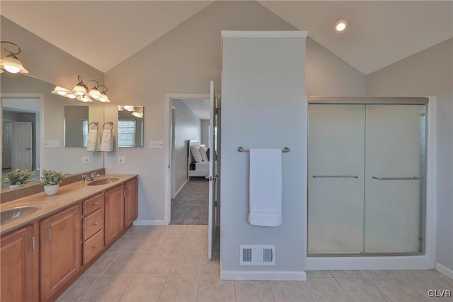 bathroom featuring vanity, tile patterned flooring, an enclosed shower, and lofted ceiling