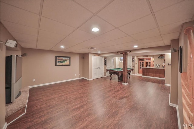 rec room with pool table, a paneled ceiling, and dark hardwood / wood-style flooring