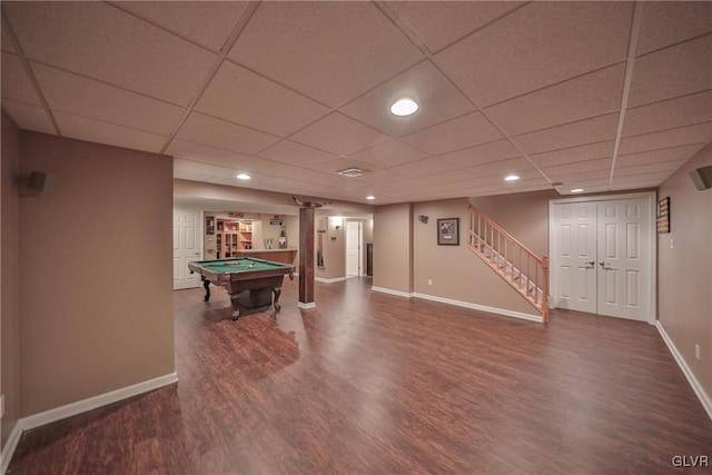 recreation room with a drop ceiling, pool table, and dark hardwood / wood-style flooring