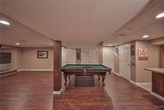 game room featuring a drop ceiling, pool table, and dark hardwood / wood-style flooring