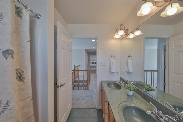 bathroom featuring tile patterned flooring and vanity