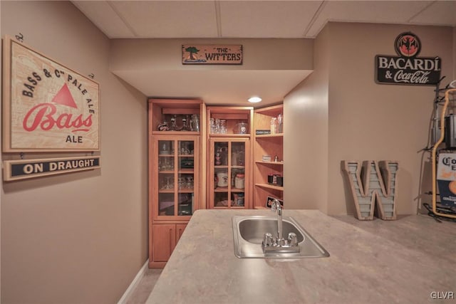 kitchen featuring sink and a paneled ceiling