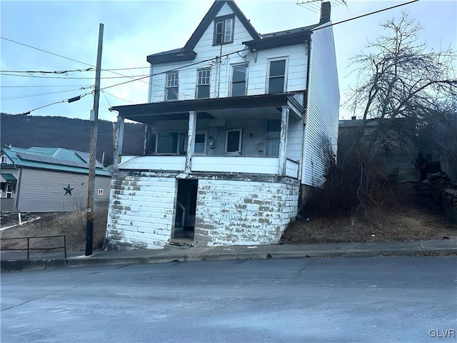 view of front of home featuring covered porch