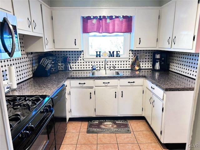 kitchen featuring sink, white cabinetry, light tile patterned floors, and black appliances