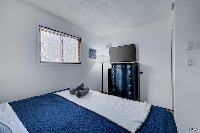 bedroom featuring a textured ceiling