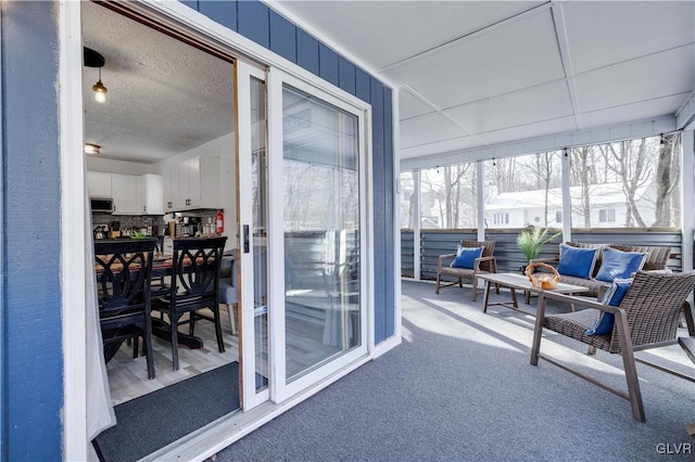 sunroom with a paneled ceiling