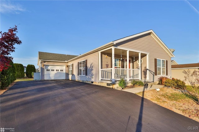 single story home with a garage and a porch