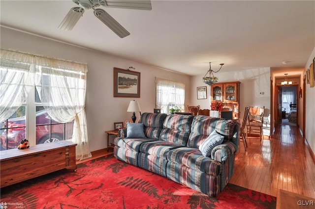 living room with ceiling fan and wood-type flooring