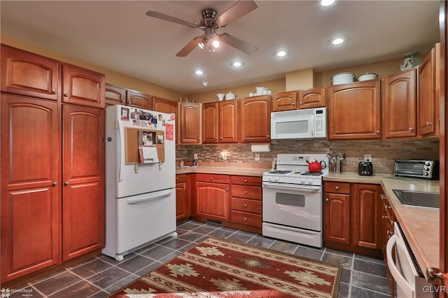 kitchen featuring decorative backsplash, sink, white appliances, and ceiling fan