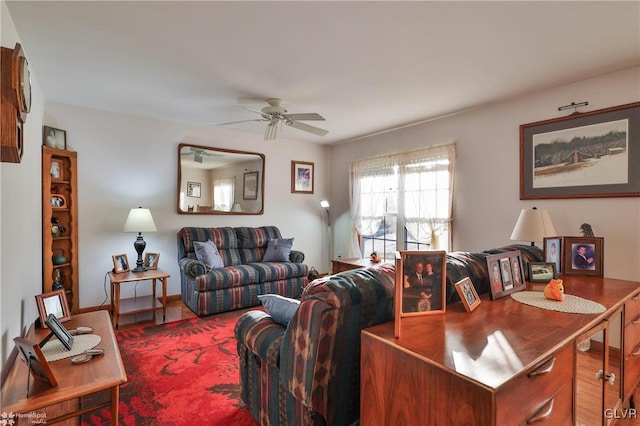 living room featuring ceiling fan and hardwood / wood-style floors