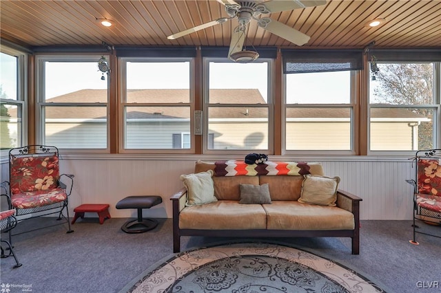 sunroom with ceiling fan and plenty of natural light